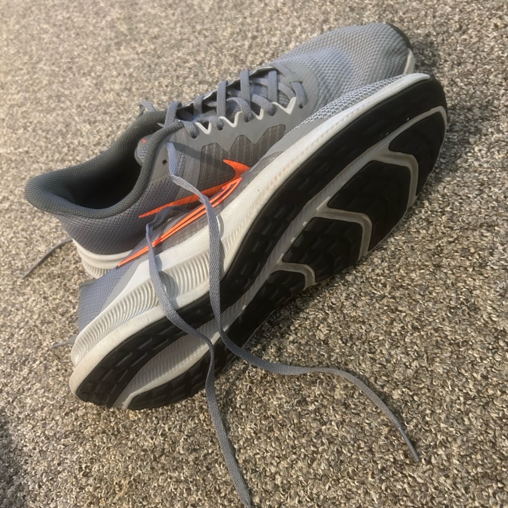 Gray and Orange Nike Downshifters